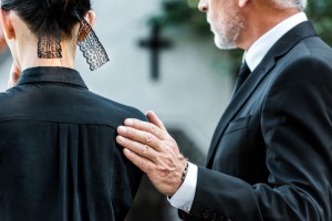Cropped,View,Of,Man,Touching,Woman,On,Funeral